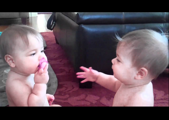 Look At These Two Cute Babies Having A Pacifier War