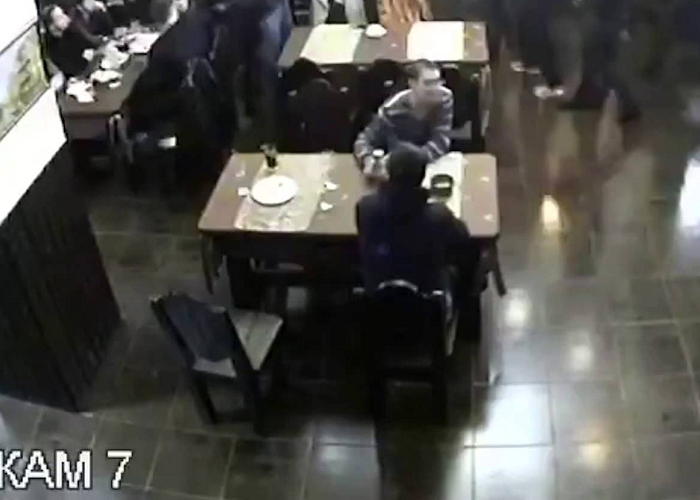 The Guy Remains Calmly Seated In The Middle Of A Restaurant Fight