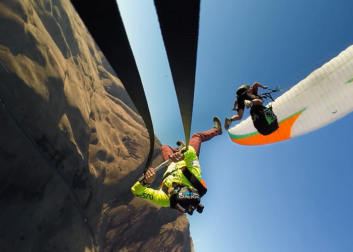 Watch These Guys Rope Swinging From A Paraglide
