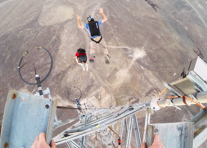 Watch These Guys Base Jumping With 9 Front Flips Off A Tower